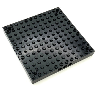 Brick Modified 12x12 with 3 Pin Holes on each Side and Peg at each Corner, Part# 47976 Part LEGO® Black