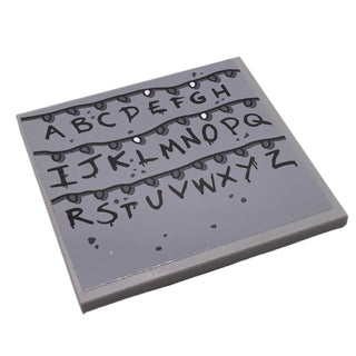 Tile 6 x 6 with Bottom Tubes with Black Alphabet Letters and Christmas Lights Pattern (Sticker), Part# 10202pb012 Part LEGO® Light Bluish Gray Very Good