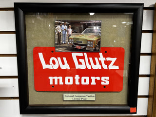Lou Glutz Motors Front Plate, from National Lampoon's Vacation Movie Prop Atlanta Brick Co   