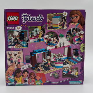 LEGO Friends set 41366 with purple box showing cupcake cafe building, minifigures, and accessories.