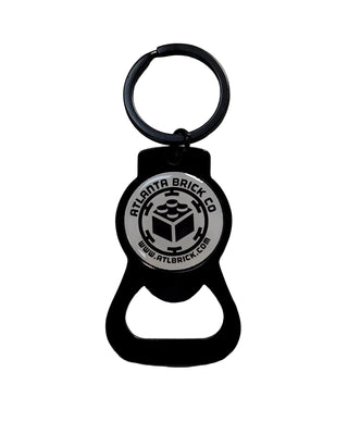 Black bottle opener with Atlanta Brick Co circular logo and keyring attachment.
