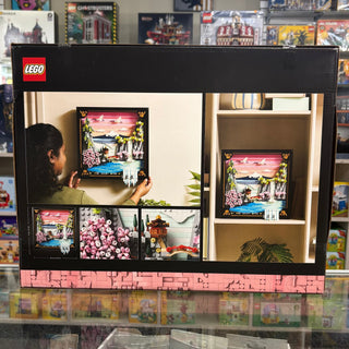 LEGO Art set packaging showing assembled cherry blossom landscape artwork with pink flowers, mountain scenery, and decorative
