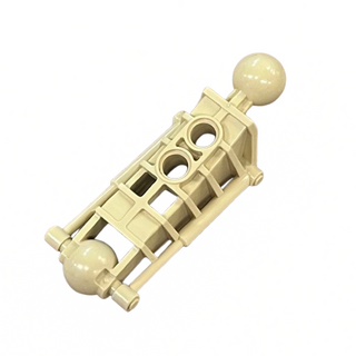 Tan Bionicle leg segment with spherical connectors at each end and cylindrical attachment points on sides.