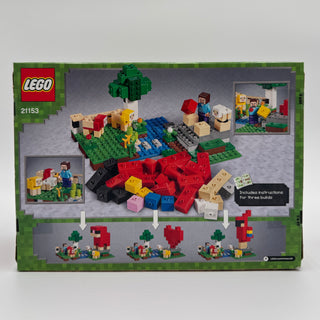 LEGO set 21153 box back showing assembled farm scene with minifigures, animals, buildings, and loose colorful bricks.