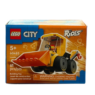 Yellow and black LEGO construction loader with front scoop bucket and minifigure driver in packaging.