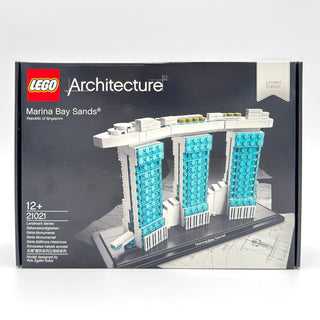 LEGO Architecture Marina Bay Sands set 21021 box featuring three turquoise towers with white base on dark packaging.
