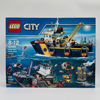 LEGO City set 60095 box showing deep sea exploration vessel with crane, minifigures, and underwater structures with sharks.