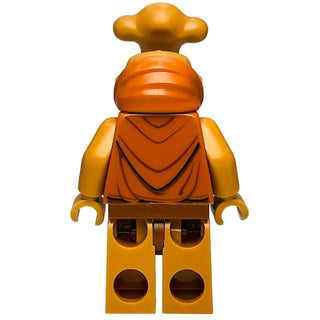 LEGO minifigure with gold elongated head, orange robe, and yellow legs with brown circular details.
