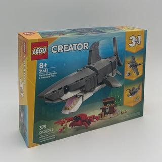LEGO Creator set 31381 box displaying gray shark with open mouth, treasure chest, and red crab figure inside ocean scene.