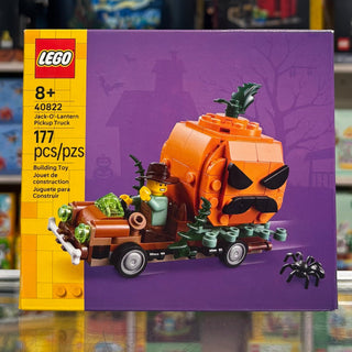 LEGO set 40822 box showing orange pumpkin-shaped truck with black details, minifigure, and spider accessory on purple backgro