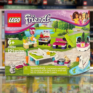 LEGO Friends set 40264 box showing purple packaging with green and pink brick accessories and outdoor scene elements.