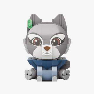 Gray and white cat-like figure with large eyes, pointed ears, blue outfit, and green accessory on head.