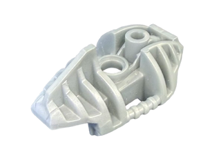Light gray Bionicle Piraka upper leg armor piece with angular ridges and two circular attachment ports.
