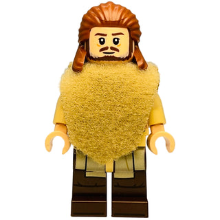 LEGO minifigure with brown hair and beard, yellow textured torso, tan poncho, and dark brown legs.