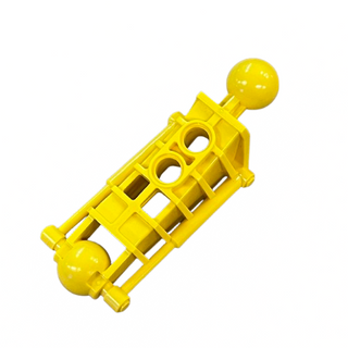 Yellow Bionicle leg piece with spherical connectors at both ends and rectangular openings along the shaft.