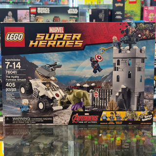 LEGO Marvel Super Heroes Hydra Fortress Smash set box showing minifigures, gray stone tower, and white armored vehicle.