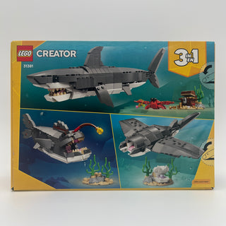 LEGO Creator set 31381 box showing gray shark with open mouth, treasure chest, and alternate build configurations.