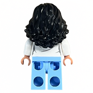LEGO minifigure with black wavy hair, white shirt, and light blue pants with dark blue circle patterns.