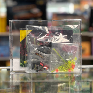 LEGO Space V-Wing Fighter set 6836 with plastic bags containing dark and neon-colored bricks and pieces inside clear display 