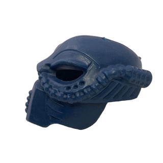 Dark blue Bionicle mask with textured side details and elongated eye opening.