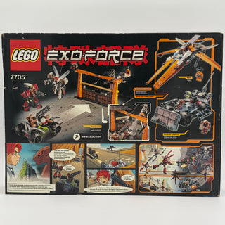 LEGO Exo-Force set 7705 box showing orange gate structure, red robot, yellow vehicle, aircraft, and comic-style instruction p