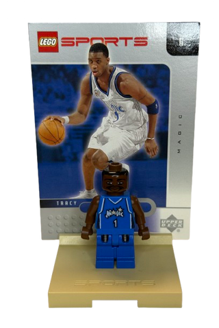 LEGO Sports minifigure of basketball player in blue Orlando Magic uniform #1 with ball on display stand.