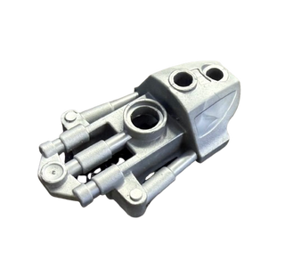 Gray and black Bionicle Toa Inika thigh cover with cylindrical connector pegs and circular socket ports.
