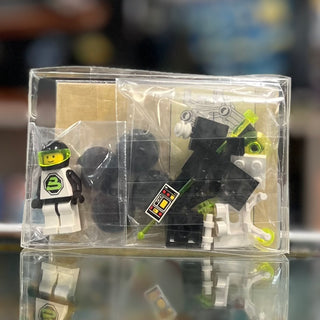 LEGO Space set 6812 containing minifigure, black and white spacecraft with lime green accents, and tan structural pieces in c