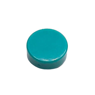 Small round teal tile with smooth glazed surface and cylindrical shape.
