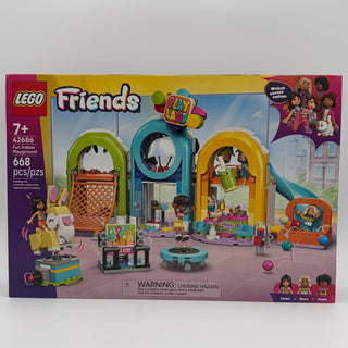 LEGO Friends set 42686 with colorful playground structures, minifigures, and accessories on display box.