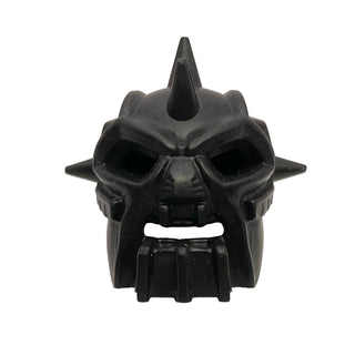 Black rubber Bionicle mask with pointed center crest, large eye openings, side spikes, and ridged mouth section.