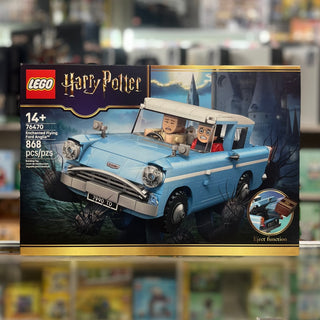 LEGO Harry Potter set 76470 box showing blue Ford Anglia car with two minifigures and castle backdrop.