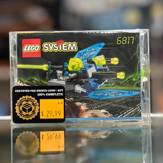 LEGO System 6817 Beta Buzzer set in clear case with blue insectoid spacecraft, yellow elements, and pricing label visible.