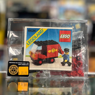 Vintage LEGO 6624 Classic Town red delivery van set in clear acrylic display case with original box and minifigure.