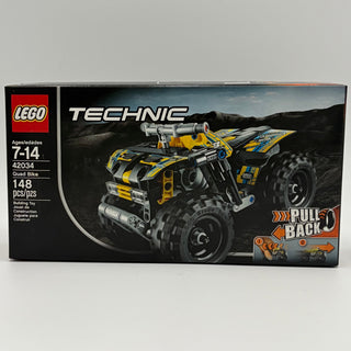 LEGO Technic Quad Bike set 42034 box featuring yellow and blue ATV model with "Pull Back" feature on desert landscape backgro