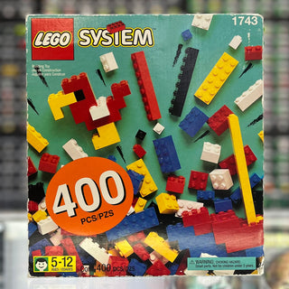 LEGO System set 1743 box containing 400 assorted bricks in red, yellow, blue, white, and black.