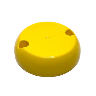 Yellow hemispherical plastic dome with flat top surface and two pin holes on opposite sides.