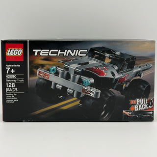 LEGO Technic Getaway Truck set 42090 box featuring black and white truck with red flame design and pull-back motor feature.