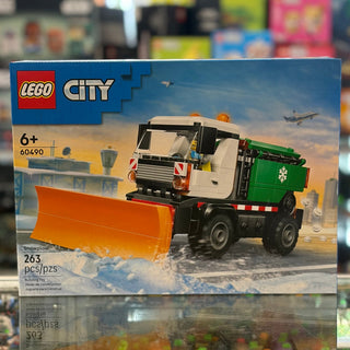 LEGO City snowplow set 60490 with white and green truck featuring orange blade attachment.