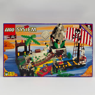 LEGO Pirates set 6281 box showing skull island fortress with palm trees, pirate ship, and minifigures on blue water base.