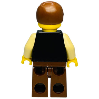 LEGO Star Wars minifigure with brown hair, yellow face and hands, black torso, and brown pants.