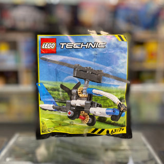 LEGO Technic Gyrocopter set 412503 in paper bag packaging showing assembled helicopter model on box front.