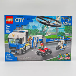 LEGO City Police Helicopter Transport set box showing police truck, helicopter, motorcycle, and minifigures on street scene.