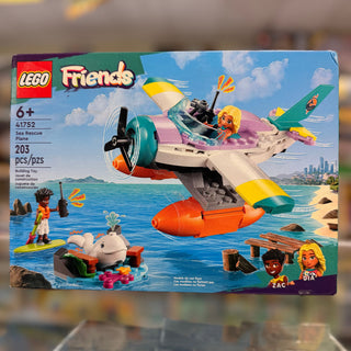 LEGO Friends Sea Rescue Plane set box showing a pink and yellow seaplane with propeller, minifigures, and ocean rescue scene.