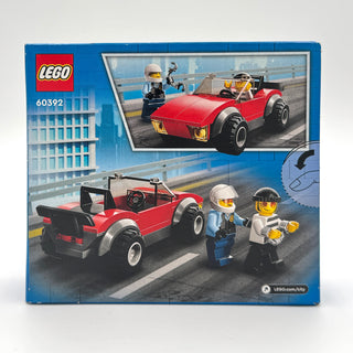 LEGO City set 60392 box showing red police car with minifigures and instruction illustrations.