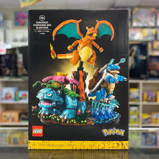LEGO Pokémon set box showing Charizard, Blastoise and Venusaur buildable figures on black packaging.