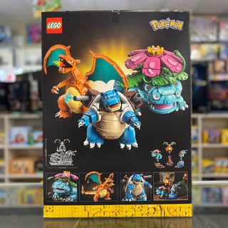 LEGO Pokémon set box showing orange Charizard, blue Blastoise, and pink Venusaur buildable figures.
