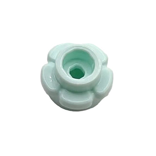 Light green plastic flower-shaped edge piece with central circular opening and four rounded petal protrusions.