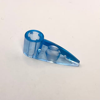 Blue Bionicle tooth piece with cylindrical axle hole and tapered end.