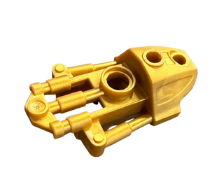 Gold Bionicle Toa Inika thigh armor piece with cylindrical connectors and circular attachment ports.